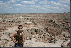 Clare on a small ledge overlooking the badlands
